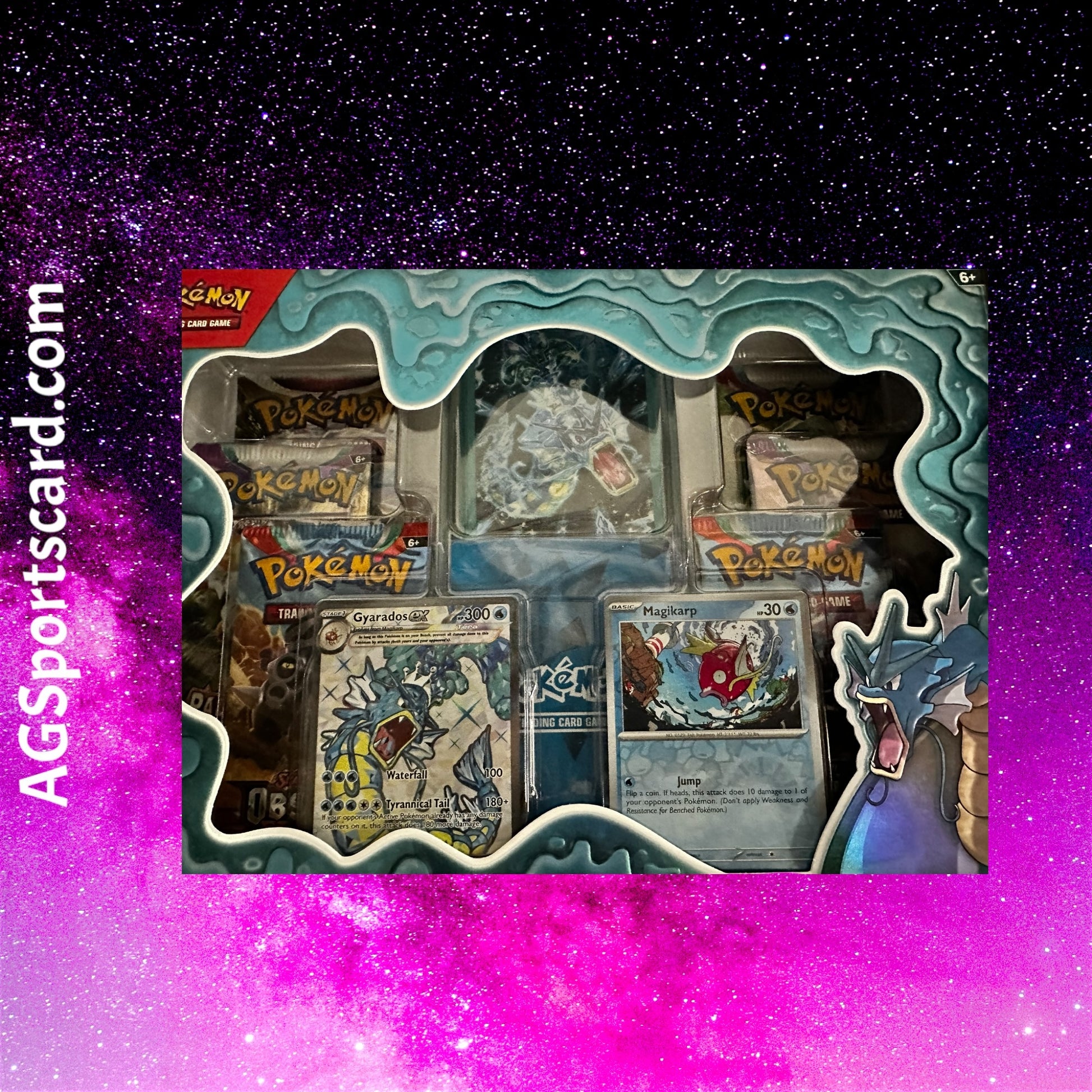 a box of pokemon trading cards on a galaxy background